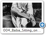 004 baba sitting on stone